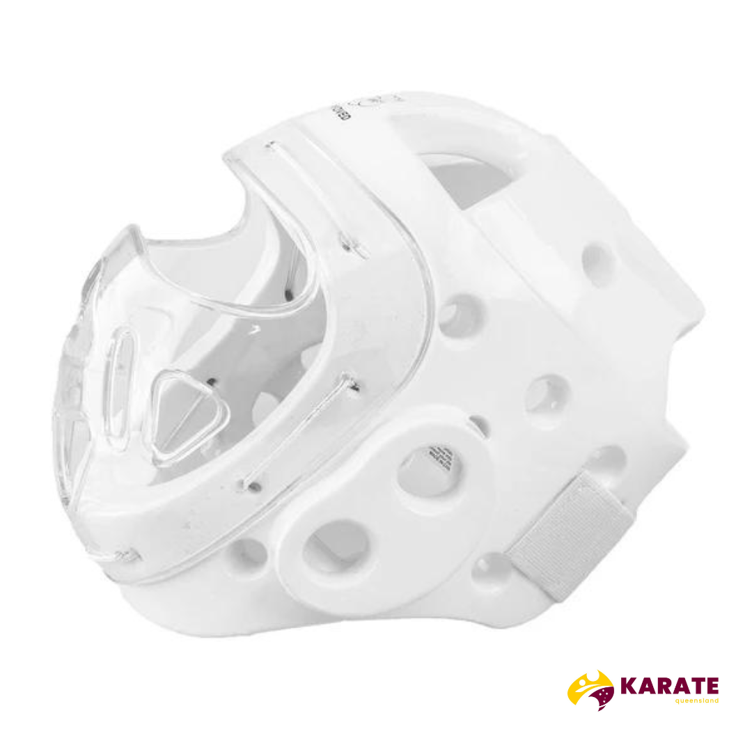 Three-quarter view of the white SMAI Karate Head Guard with a clear mask, displaying the side and under-chin straps and padding.