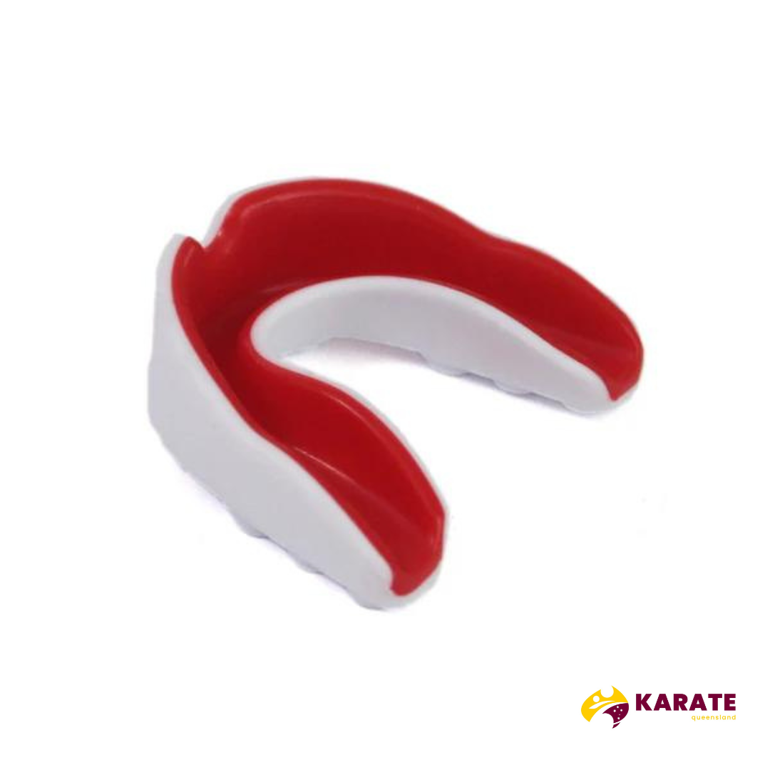 Red and white dual-color sports mouth guard with a curved design for a secure fit.